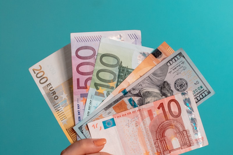 A fan of banknotes in several currencies.